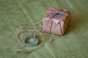  gift box with ribbon and bow on green background