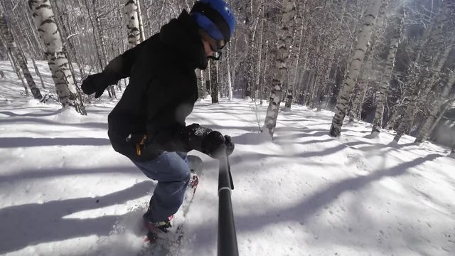 4k video person snowboarder snowboarding down slope closeup with gopro