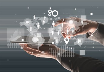 Male hands holding a tablet PC on background