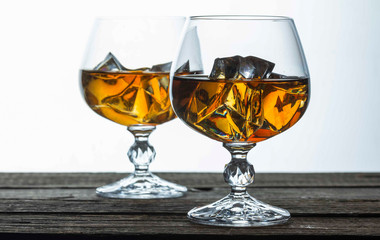 glasses for brandy close-up on an old wooden background