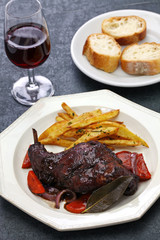 rabbit cooked in red wine with french fries