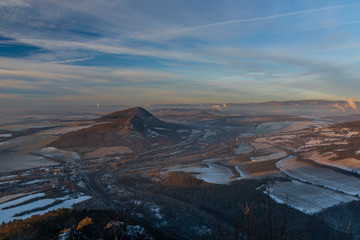 Fototapeta na wymiar Sunrise on Boren hill near Bilina town in winter frosty morning