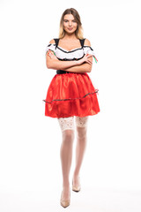 Full height of Bavarian girl in dirndl isolated over white background
