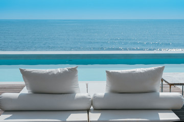 luxury swimming pool on sea view and beach chair in hotel resort - obrazy, fototapety, plakaty