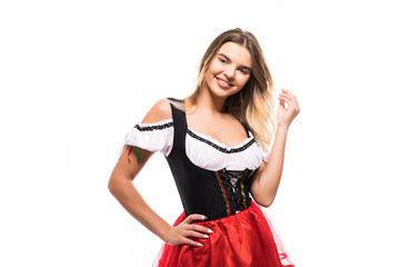 Beautiful woman in a traditional bavarian dirndl isolated on white background