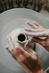Top view of clay products, on a pottery wheel with copy space