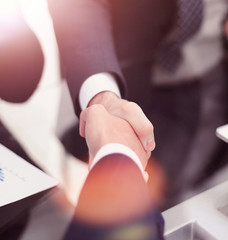 Close up of businessmen shaking hands