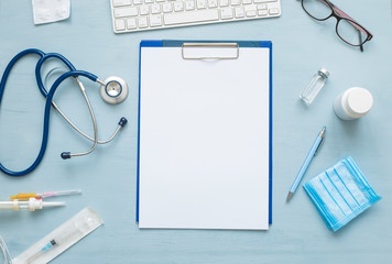 Top view of blank paper for writing doctor prescription. Stethoscope and medical attributes.  - obrazy, fototapety, plakaty