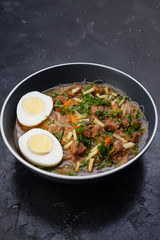 Home food Asia, Vietnam, egg noodle soup, colorful food ingredient for this food such as egg, beef, broth, ginger, soy sauce, carrot, vegetable