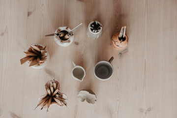 Set of dirty art and craft sculpting tools on wooden table in pottery workshop