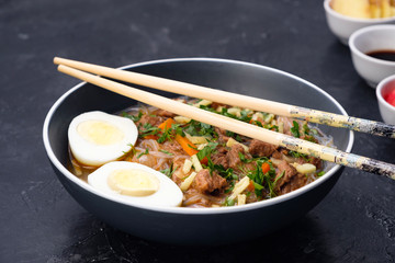 Home food Asia, Vietnam, egg noodle soup, colorful food ingredient for this food such as egg, beef, broth, ginger, soy sauce, carrot, vegetable