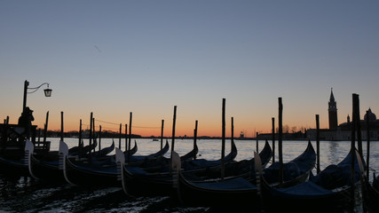 Venice Sunrise with nobody, Black Gondola and Golden Sun Light over the Grand Canal