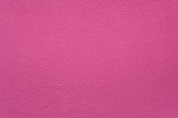 Pink painted stucco wall. Background texture.