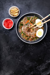 Home food Asia, Vietnam, egg noodle soup, colorful food ingredient for this food such as egg, beef, broth, ginger, soy sauce, carrot, vegetable
