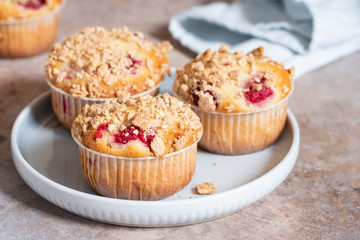 Fresh homemade delicious raspberry muffins on a table