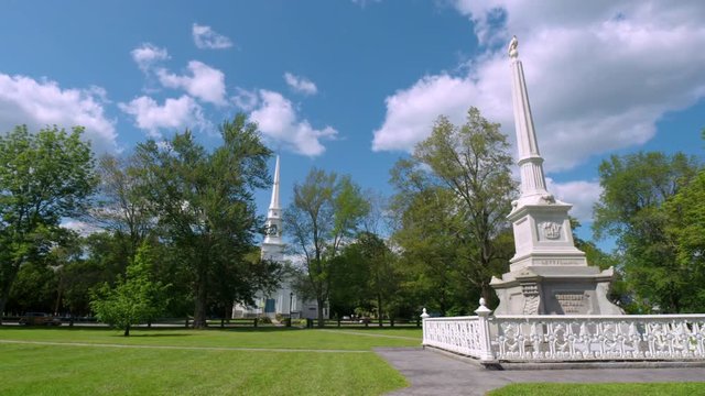Monument in center of town green in small New England community park