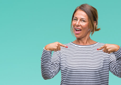 Middle Age Senior Hispanic Woman Over Isolated Background Looking Confident With Smile On Face, Pointing Oneself With Fingers Proud And Happy.