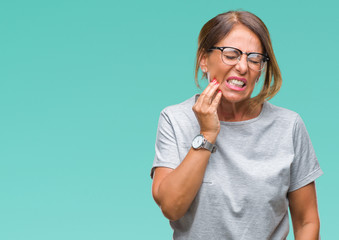 Middle age senior hispanic woman wearing glasses over isolated background touching mouth with hand...