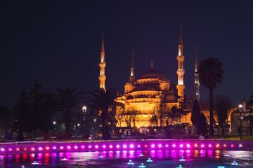 Fountain on Sultanahmet area in evening time. Multicolored streams against the background of the...