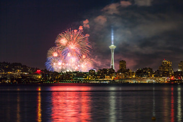 Lake Union 4th of July Fireworks and the Seattle skyline, as seen from across Elliott Bay at...