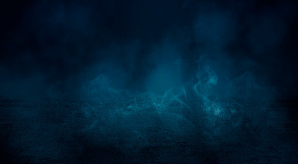 Fototapeta na wymiar Black background of empty street, room, blue searchlight illuminates asphalt, smoke
