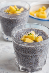 Mango chia pudding with almond milk in glasses, healthy  breakfast meal