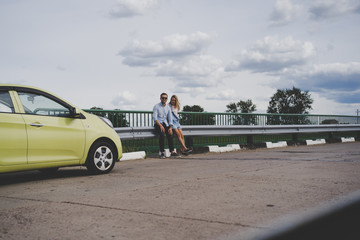 Couple in love traveling by car.