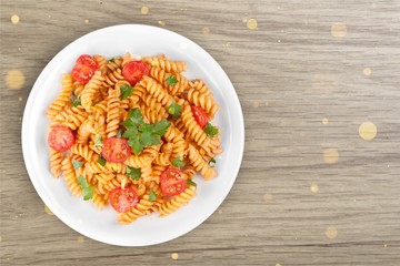 Pasta fusilli with bolognese tomato beef sauce on the kitchen