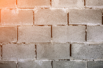Brick walls background with a concrete texture between stones. Renovation and repair works of the building house.