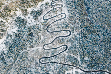 Aerial view of a winding road after a heavy snowfall