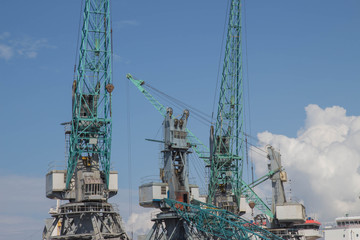 Fototapeta na wymiar Cargo crane sea port, Cranes in marine terminal