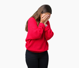 Young beautiful brunette woman wearing red winter sweater over isolated background with sad expression covering face with hands while crying. Depression concept.