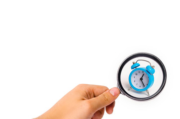 A blue alarm clock on a white background. The concept of time and planning. The past, the future and the present. Minimalism. Free or business hours. Life expectancy. Abstraction of time.