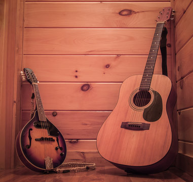 Rustic Mandolin And Acoustic Guitar In Cabin Hallway