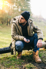 Fototapeta premium Young blogger photographer travel in mountain forest