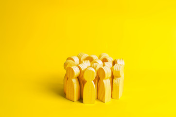 Group of yellow people on a yellow background. Crowd, meeting, social activity. Society. Inert society. Herd instinct, management of people. Human resources, workers stand together. Disguise
