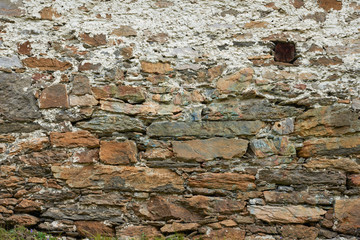 Old style stone barn wall texture.