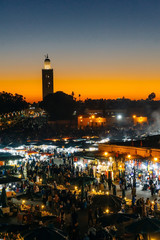 Fototapeta na wymiar Marrakesh (Morocco). Jemaa el-Fnaa square (market place) in the evening.