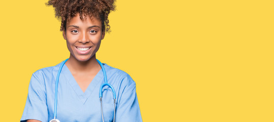 Young african american doctor woman over isolated background happy face smiling with crossed arms...