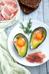 healthy Breakfast with avocado on wooden table