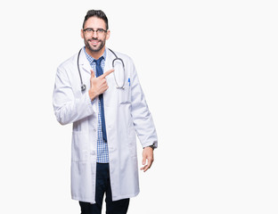 Handsome young doctor man over isolated background cheerful with a smile of face pointing with hand and finger up to the side with happy and natural expression on face