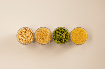 Cereals, rice, peas, couscous, oatmeal, in transparent containers, view from above