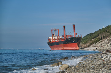 GELENDZHIK, RUSSIA - JAN 19, 2019: The ship called Rio ran aground after a storm in the black sea. The ship went to the port of Novorossiysk for loading