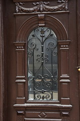 old  wooden door,wrought iron window