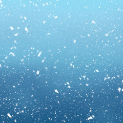 Snow falls on winter blue sky background
