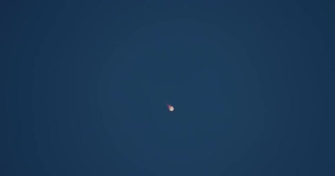 Rocket first-stage booster fires retro-rockets to begin descent back to landing zone at Cape Canaveral. 4K at 120 fps slow motion.