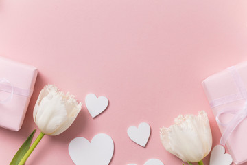 Pink celebration background, flowers, hearts and gift.