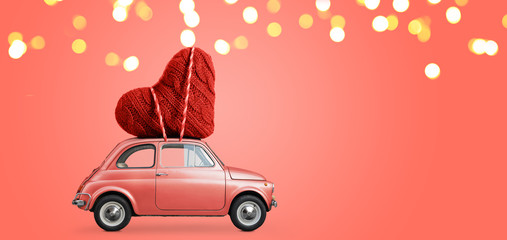 Living coral retro toy car delivering craft heart for Valentine's day on coral background - 245027697
