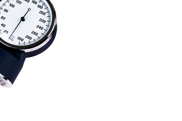 A Blood pressure manometer on a cardiogram (ECG) isolated on white background. Aneroid...
