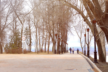 Family with a child walks along the promenade. Walk around Nizhny Novgorod and the Kremlin